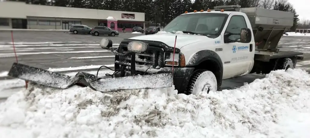 Commercial Parking lot snow removal with snowplow